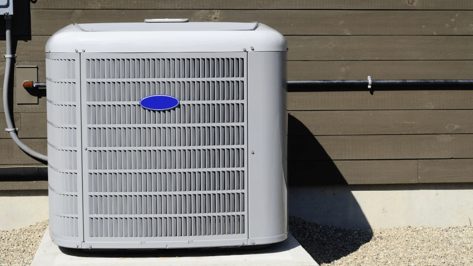Ductless mini split heat pump unit installed outside a building, showcasing energy-efficient HVAC technology relevant to