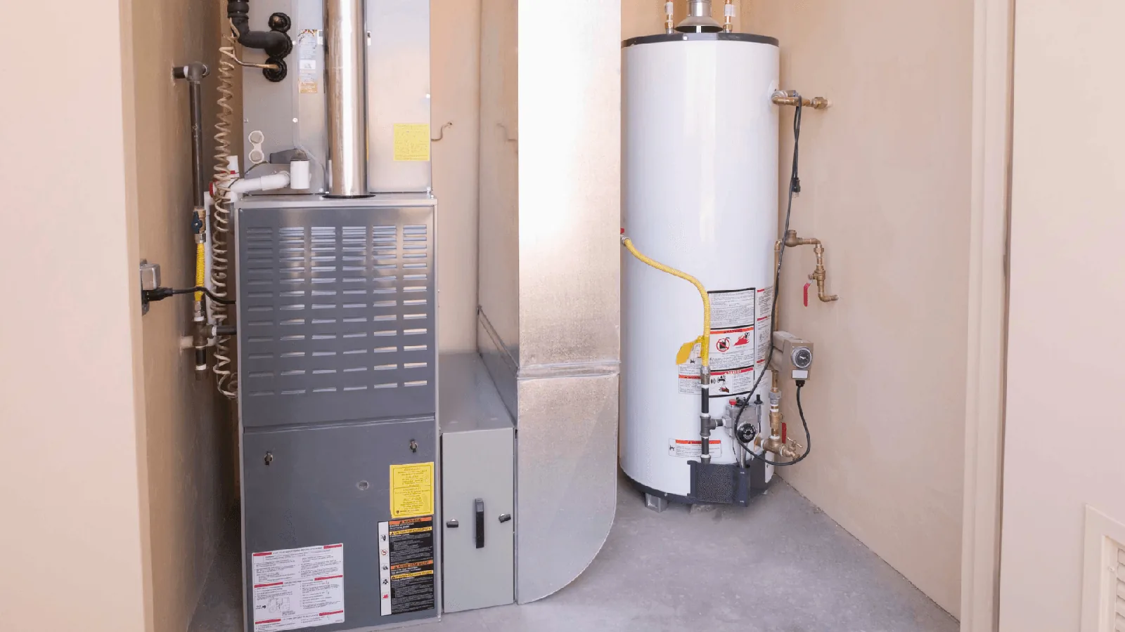 Heating system installation featuring a furnace and water heater, relevant to HVAC services and troubleshooting for lukewarm air issues.