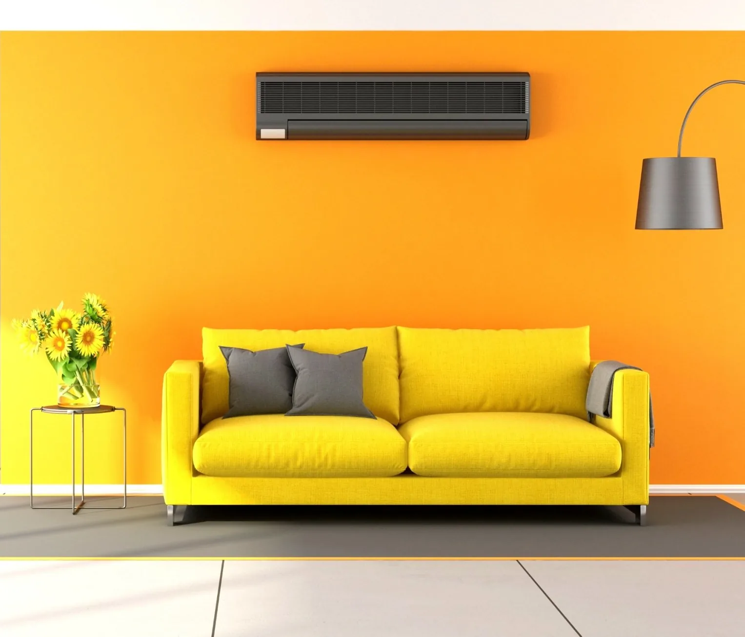 Yellow sofa with gray pillows and a decorative vase of sunflowers, featuring a wall-mounted air conditioning unit above