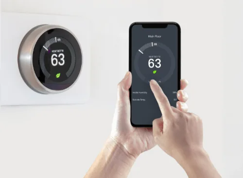 Smart thermostat displayed on wall