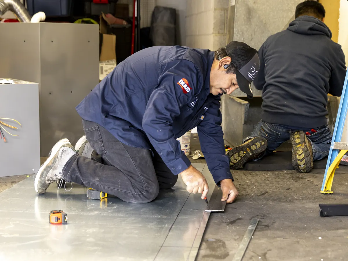 Best Owner Direct HVAC & Electrical technicians fabricating ductwork in the shop