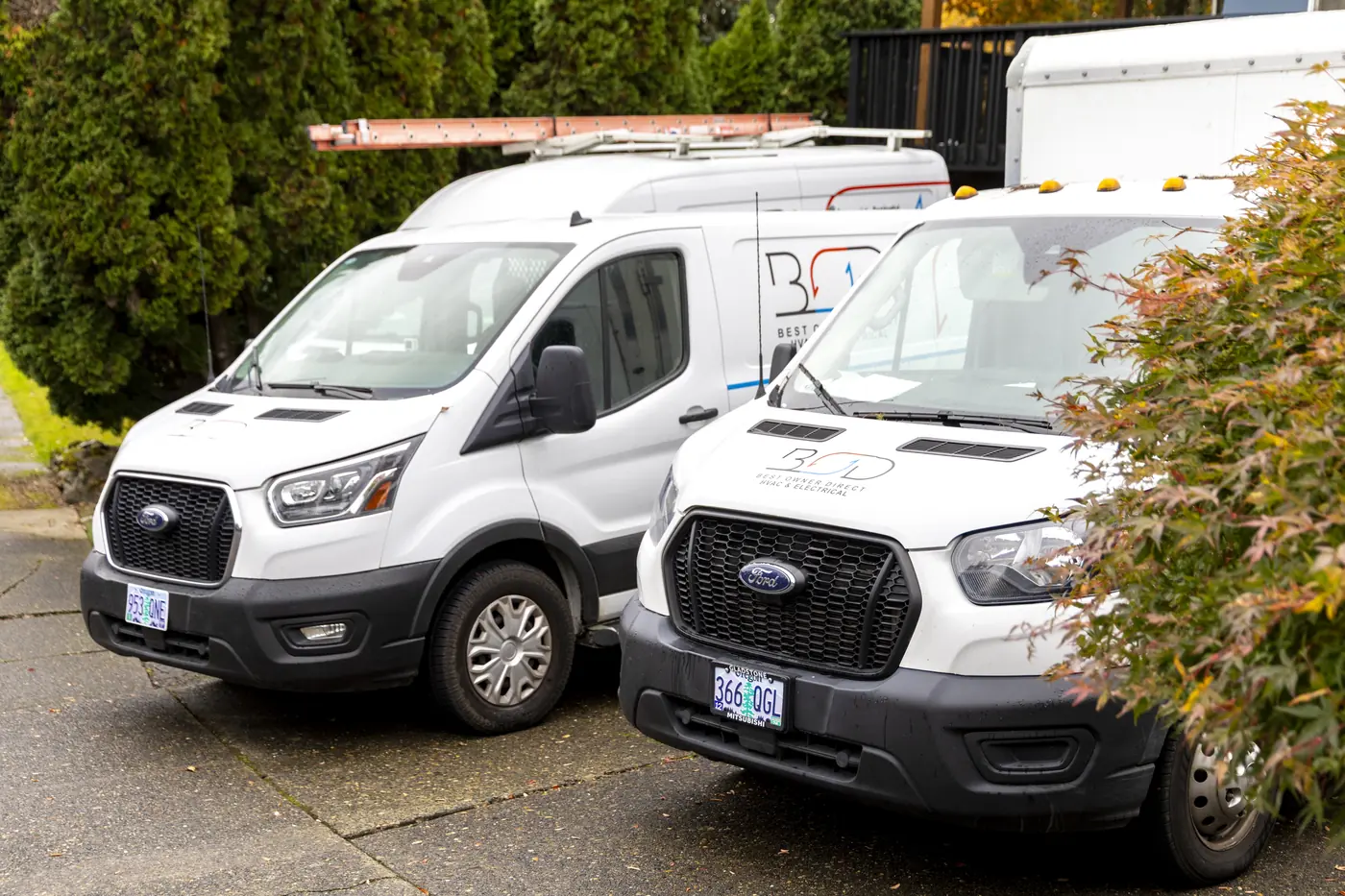 Best Owner Direct HVAC & Electrical service vans parked at the shop