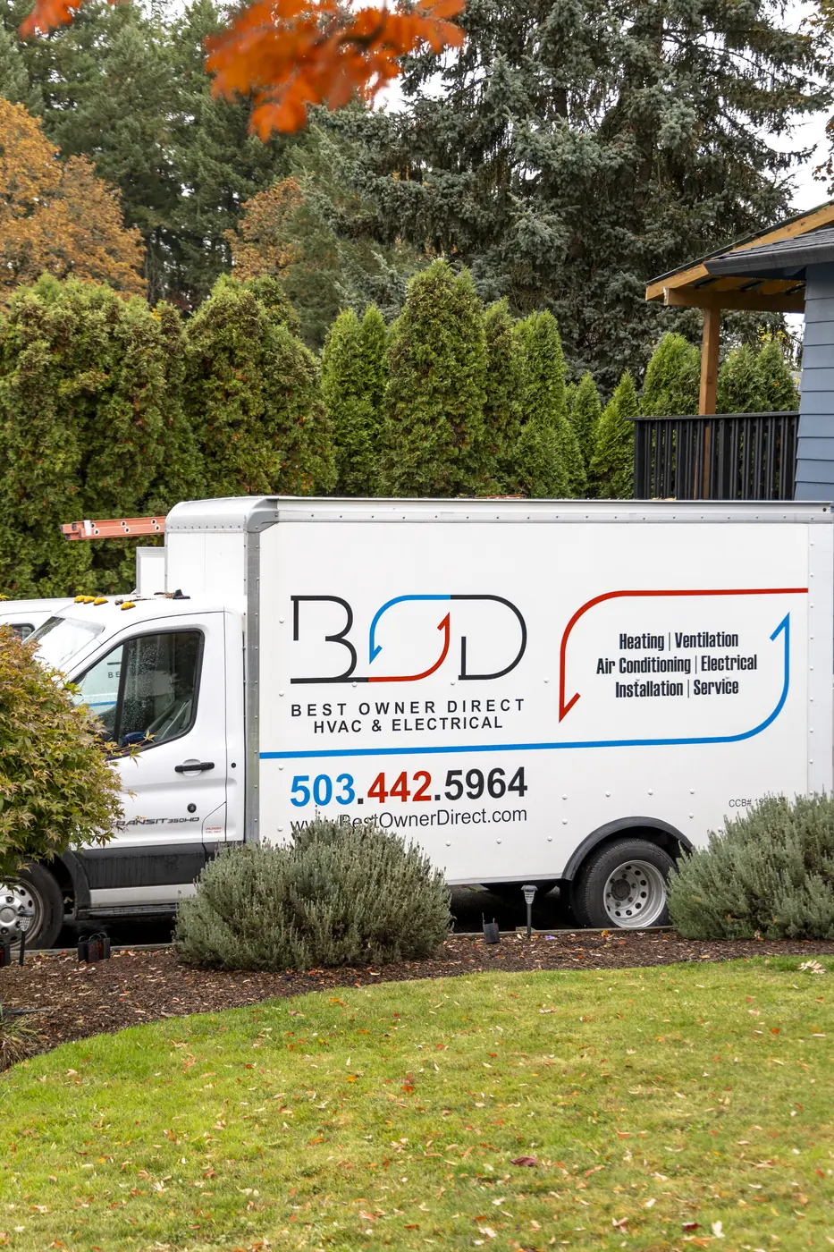 Best Owner Direct HVAC & Electrical service van parked at a customer's home