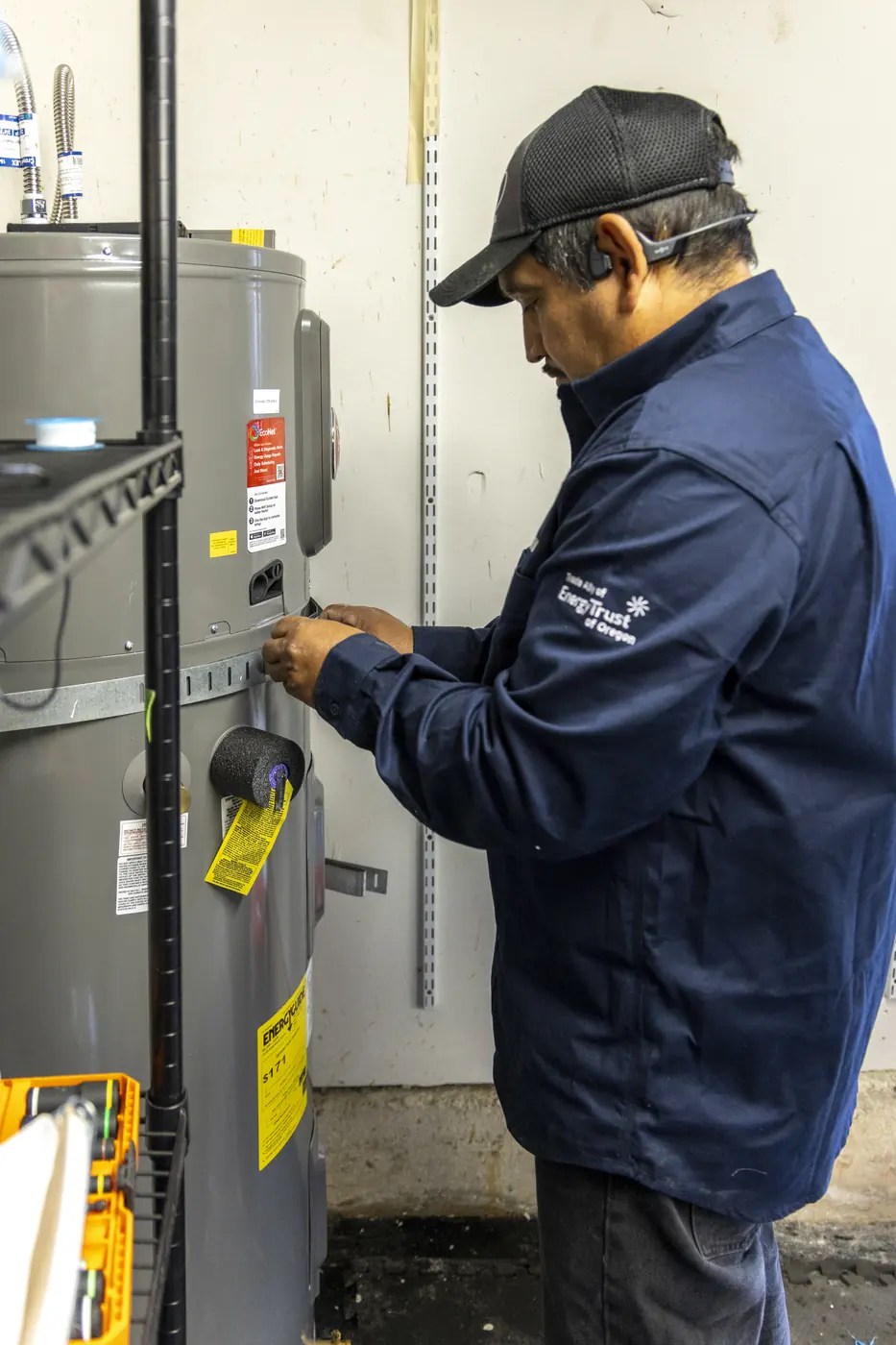 Technician servicing a residential water heater