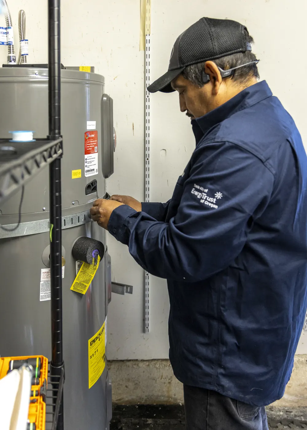 A Best Owner Direct technician servicing a water heater